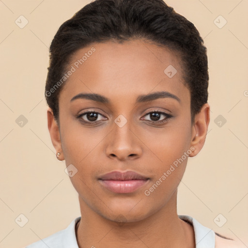 Joyful latino young-adult female with short  black hair and brown eyes