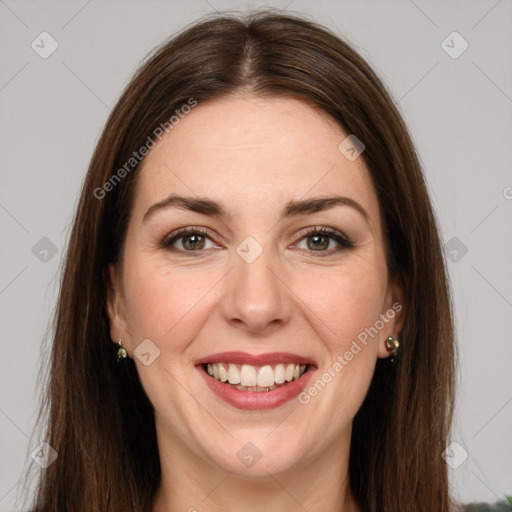 Joyful white young-adult female with long  brown hair and green eyes