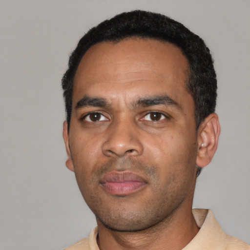 Neutral black young-adult male with short  black hair and brown eyes