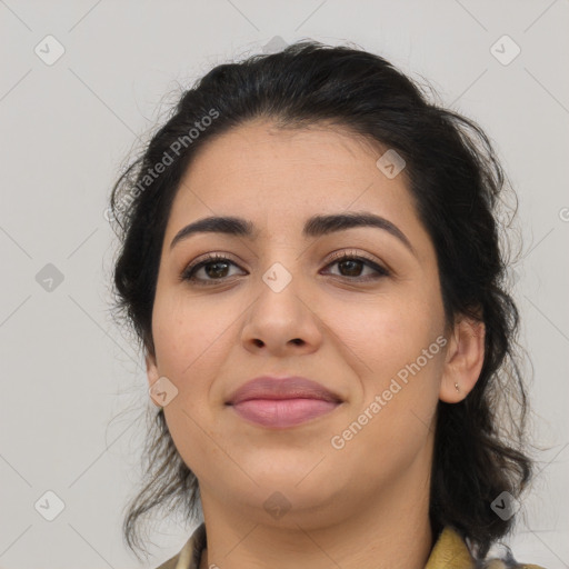 Joyful latino young-adult female with medium  brown hair and brown eyes