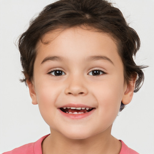 Joyful white child female with short  brown hair and brown eyes