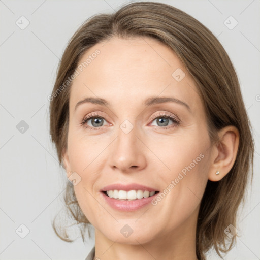 Joyful white young-adult female with medium  brown hair and grey eyes