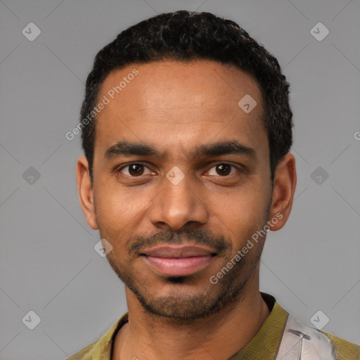 Joyful black young-adult male with short  black hair and brown eyes