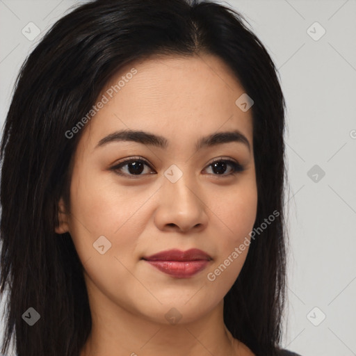 Joyful asian young-adult female with long  brown hair and brown eyes