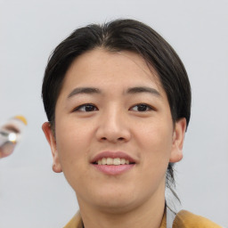 Joyful asian young-adult female with short  brown hair and brown eyes