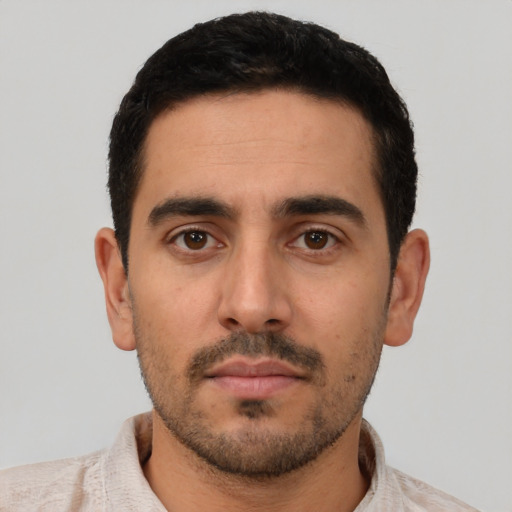 Neutral white young-adult male with short  black hair and brown eyes