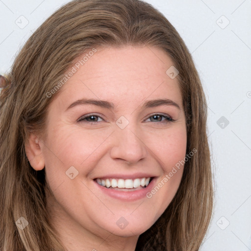 Joyful white young-adult female with long  brown hair and grey eyes