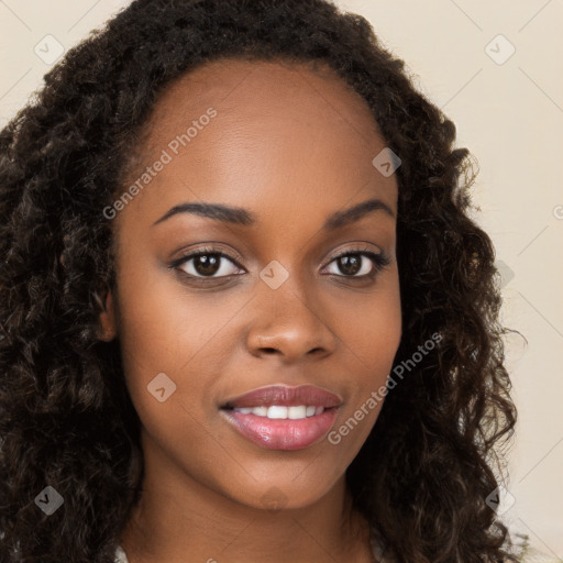 Joyful black young-adult female with long  brown hair and brown eyes