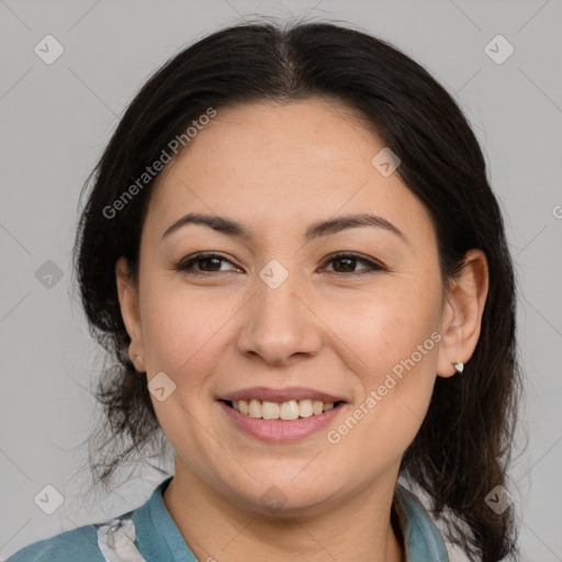 Joyful asian adult female with medium  brown hair and brown eyes