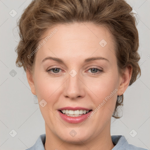 Joyful white adult female with short  brown hair and grey eyes