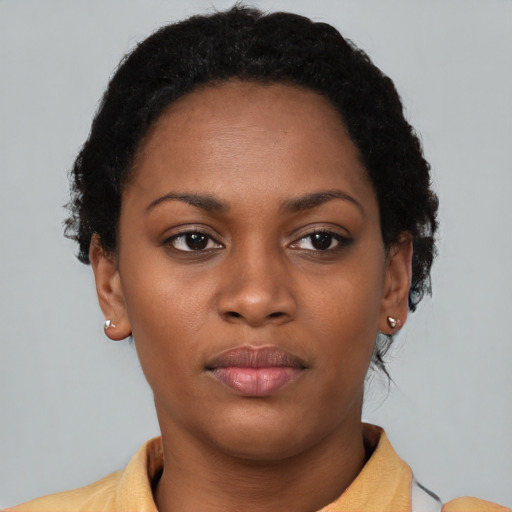 Neutral black young-adult female with short  brown hair and brown eyes