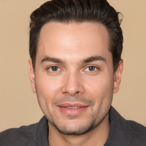 Joyful white young-adult male with short  brown hair and brown eyes