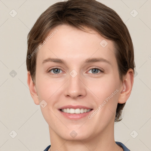 Joyful white young-adult female with short  brown hair and grey eyes