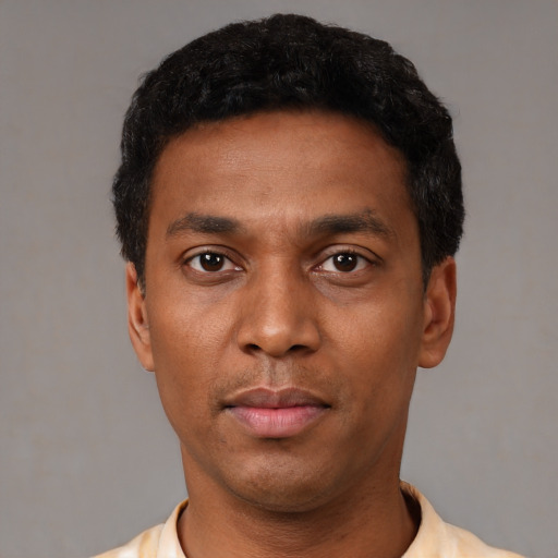 Neutral black young-adult male with short  black hair and brown eyes