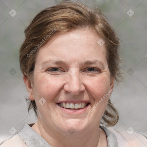 Joyful white adult female with medium  brown hair and blue eyes