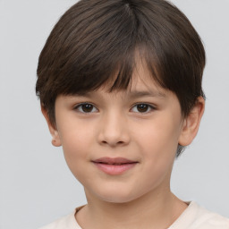 Joyful white child female with short  brown hair and brown eyes