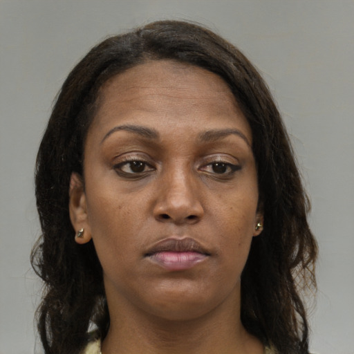 Neutral black young-adult female with medium  brown hair and brown eyes