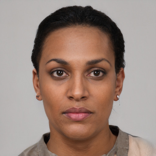 Neutral latino young-adult female with short  black hair and brown eyes