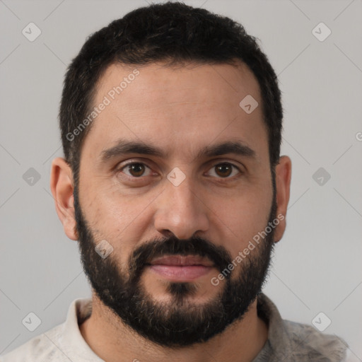 Joyful white young-adult male with short  black hair and brown eyes