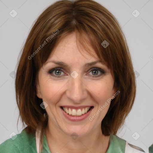 Joyful white adult female with medium  brown hair and grey eyes