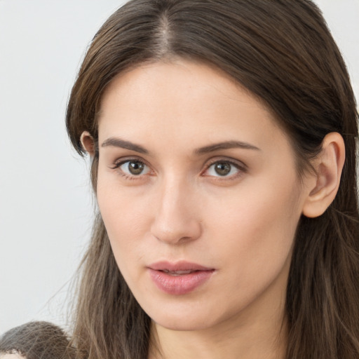 Neutral white young-adult female with long  brown hair and brown eyes