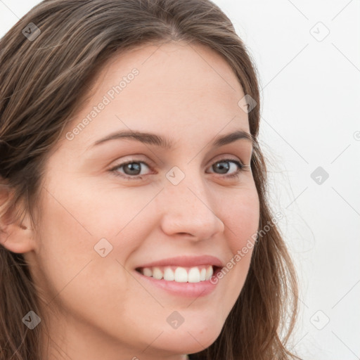 Joyful white young-adult female with long  brown hair and blue eyes