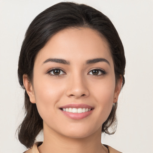 Joyful white young-adult female with long  brown hair and brown eyes