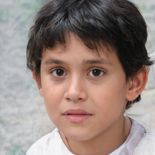 Joyful white child male with short  brown hair and brown eyes