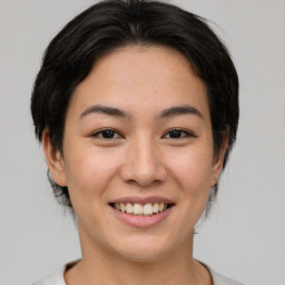 Joyful asian young-adult female with medium  brown hair and brown eyes