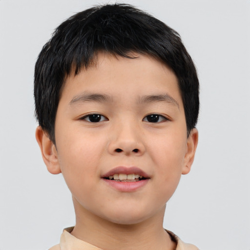 Joyful asian child male with short  brown hair and brown eyes