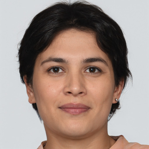 Joyful white young-adult female with short  brown hair and brown eyes