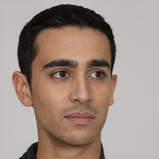 Neutral latino young-adult male with short  black hair and brown eyes