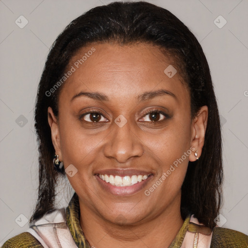 Joyful latino adult female with medium  brown hair and brown eyes