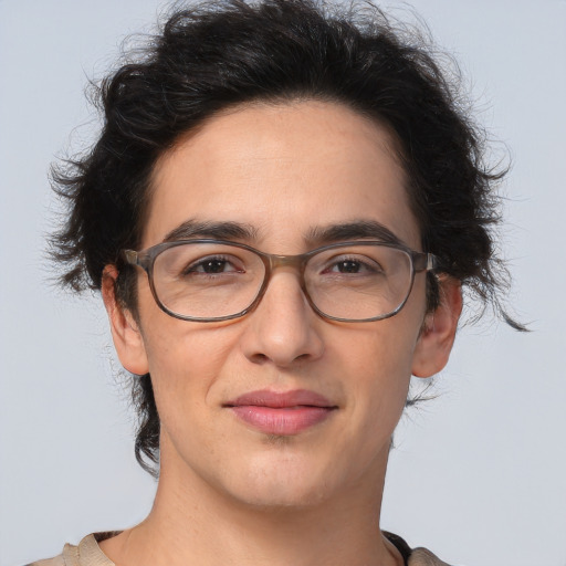 Joyful white adult male with medium  brown hair and brown eyes