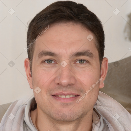 Joyful white adult male with short  brown hair and brown eyes