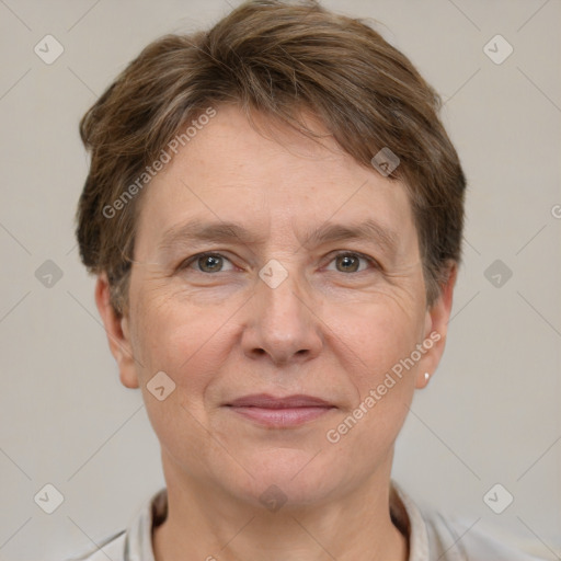 Joyful white adult female with short  brown hair and grey eyes