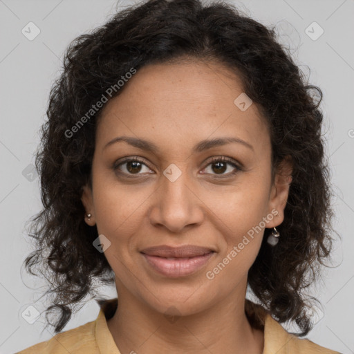 Joyful black adult female with medium  brown hair and brown eyes