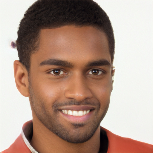 Joyful black young-adult male with short  brown hair and brown eyes