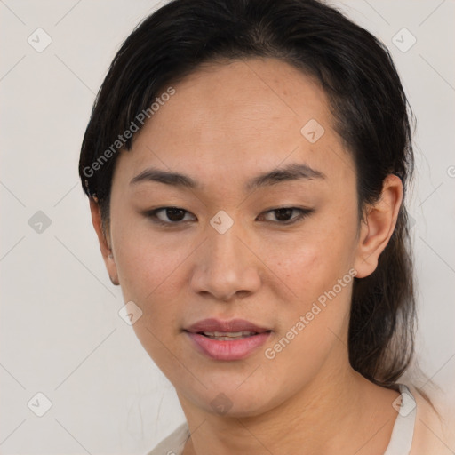 Joyful asian young-adult female with medium  black hair and brown eyes