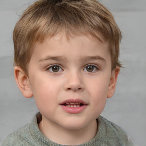 Joyful white child male with short  brown hair and grey eyes