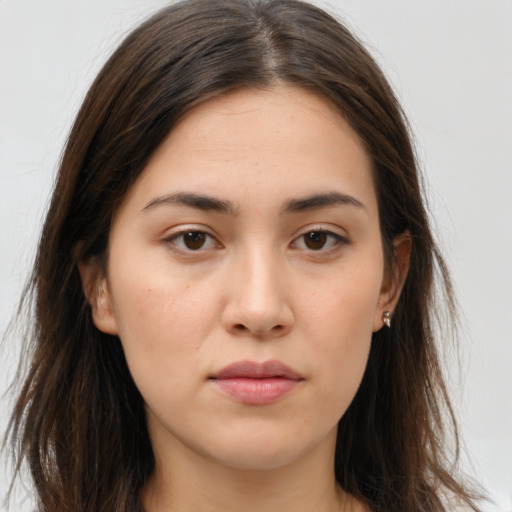 Neutral white young-adult female with long  brown hair and brown eyes