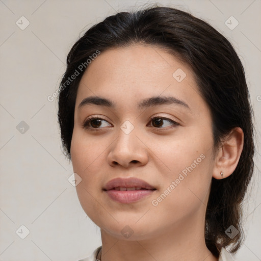 Joyful asian young-adult female with medium  brown hair and brown eyes