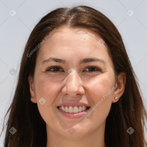 Joyful white adult female with long  brown hair and grey eyes