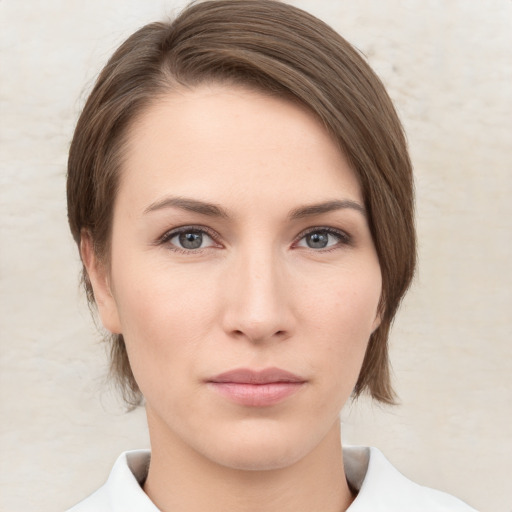 Neutral white young-adult female with medium  brown hair and grey eyes