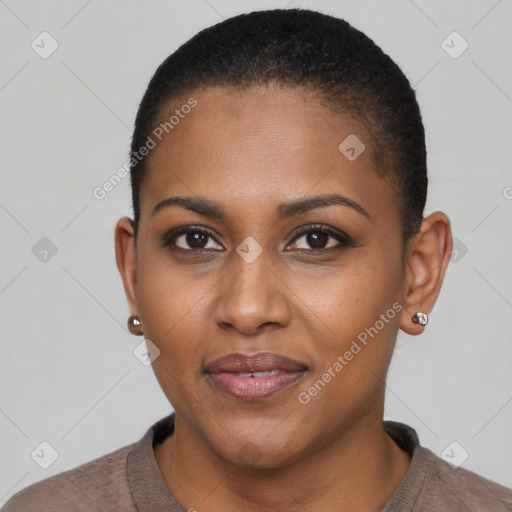 Joyful black young-adult female with short  black hair and brown eyes