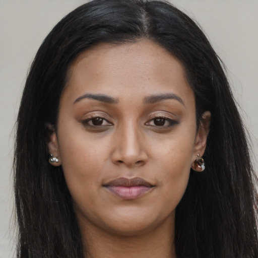 Joyful asian young-adult female with long  brown hair and brown eyes