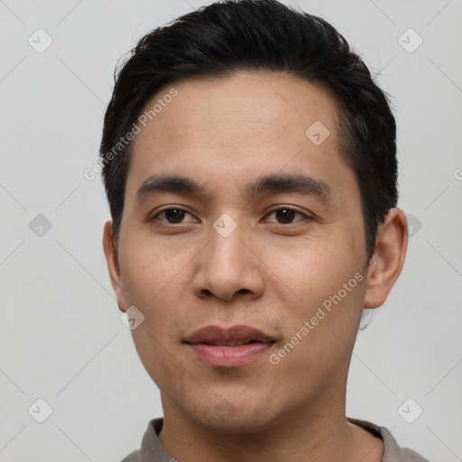 Joyful asian young-adult male with short  black hair and brown eyes