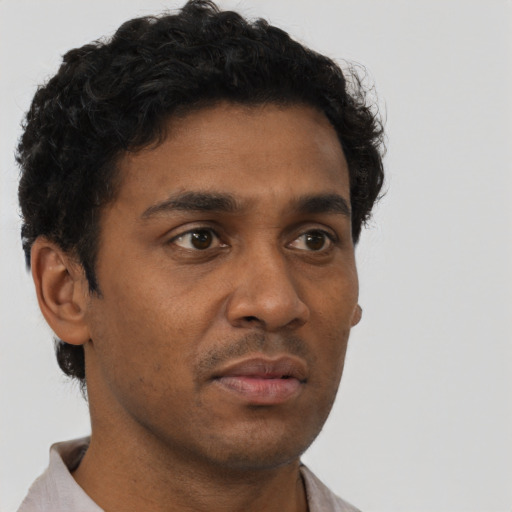 Neutral latino young-adult male with short  brown hair and brown eyes