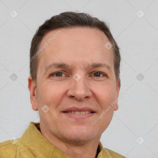 Joyful white adult male with short  brown hair and brown eyes