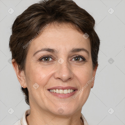 Joyful white adult female with short  brown hair and brown eyes